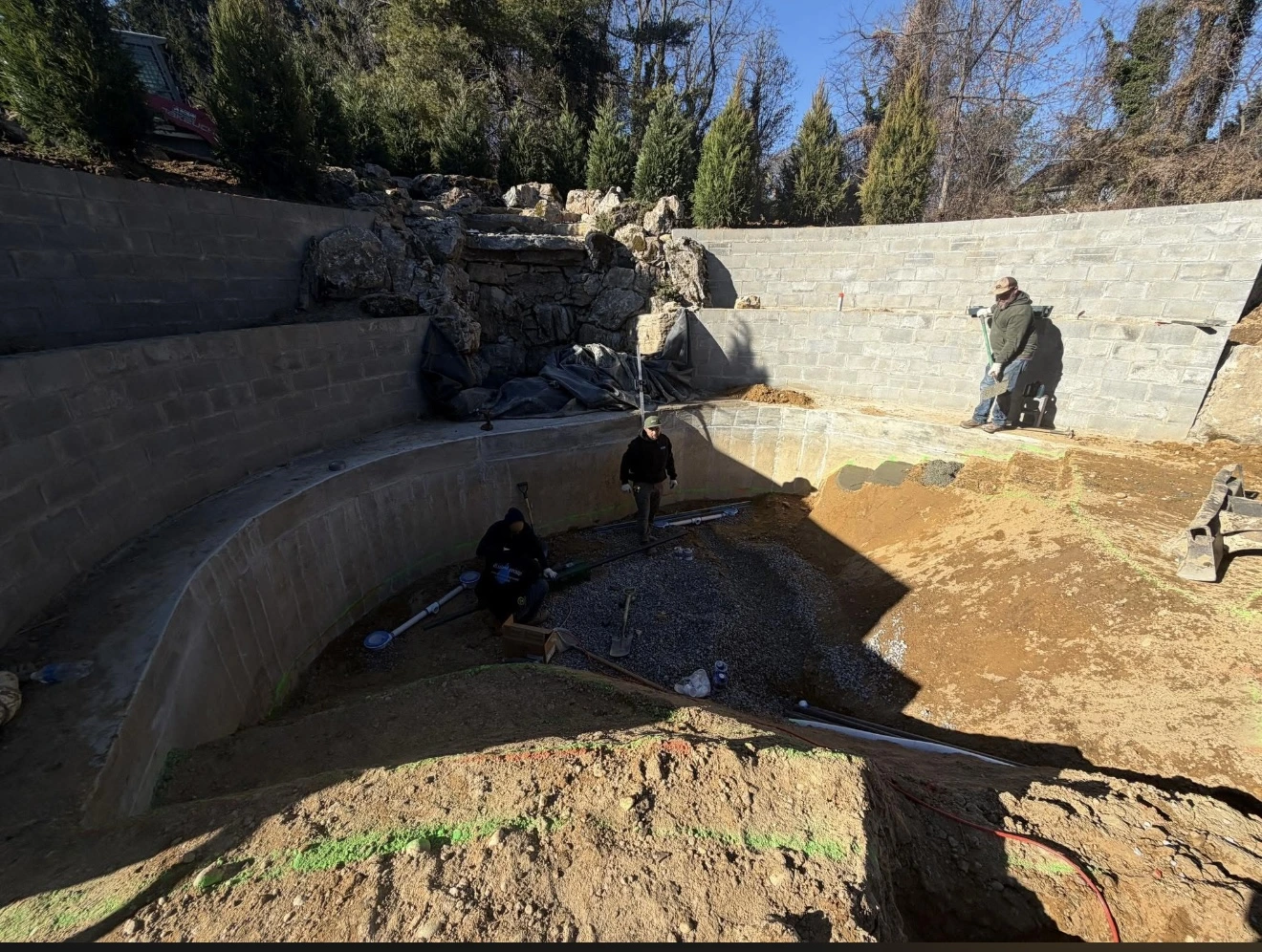 Naturi team building a sand pool alongside a certified installer