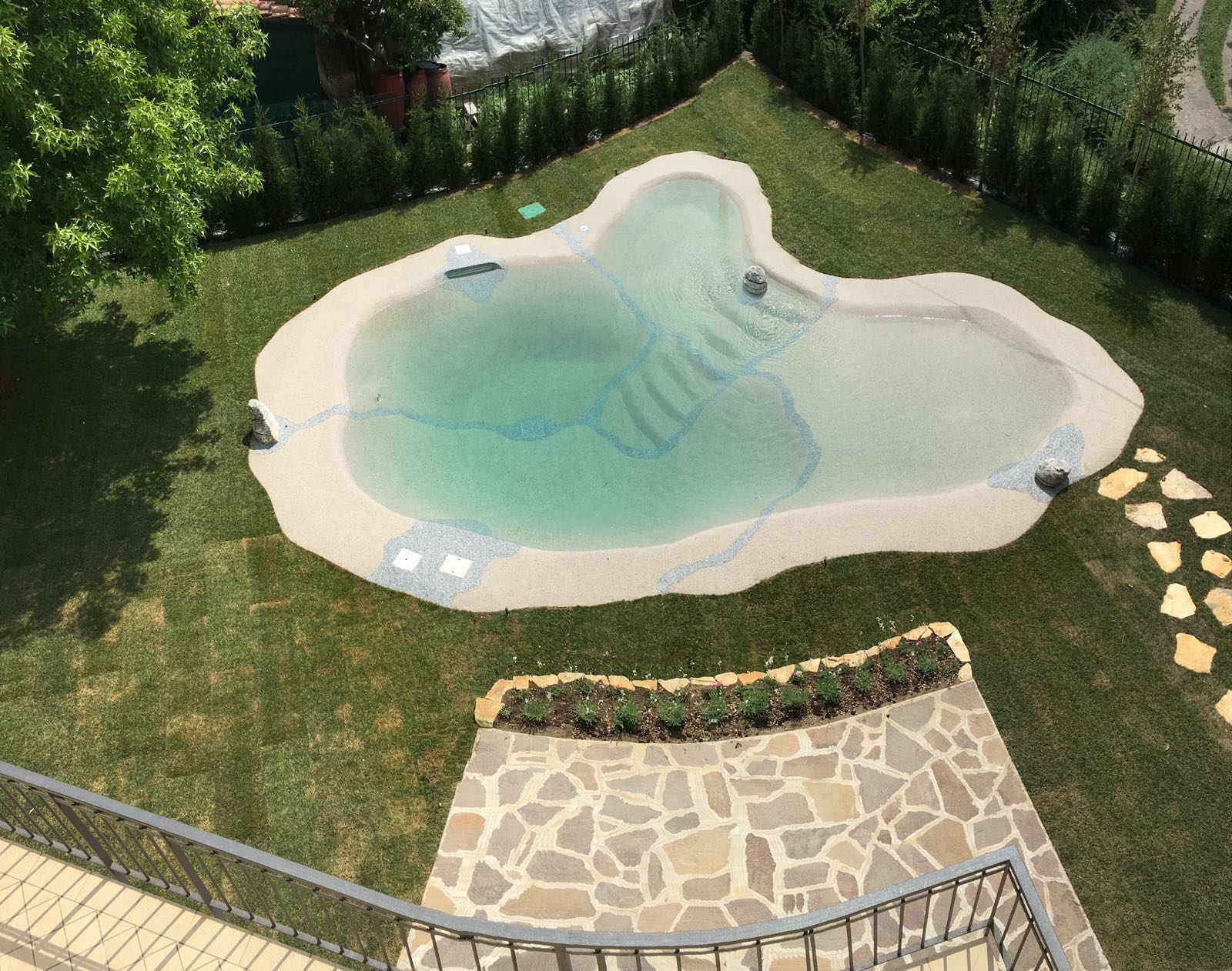 Naturi hand-troweled beach entry sand pool